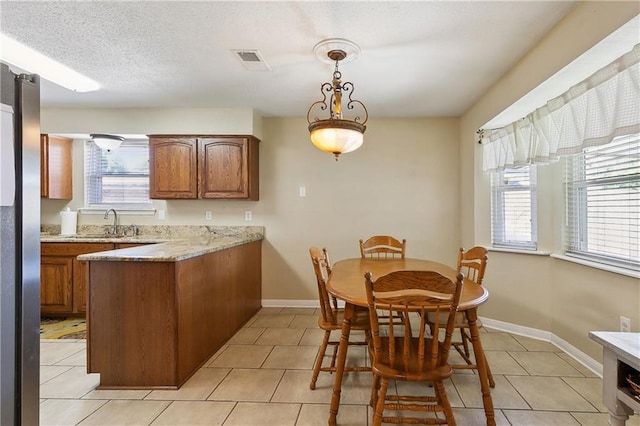 3121 Arbutus Ln, Marrero, LA 70072 - dining area with light tile patterned floors and baseboards