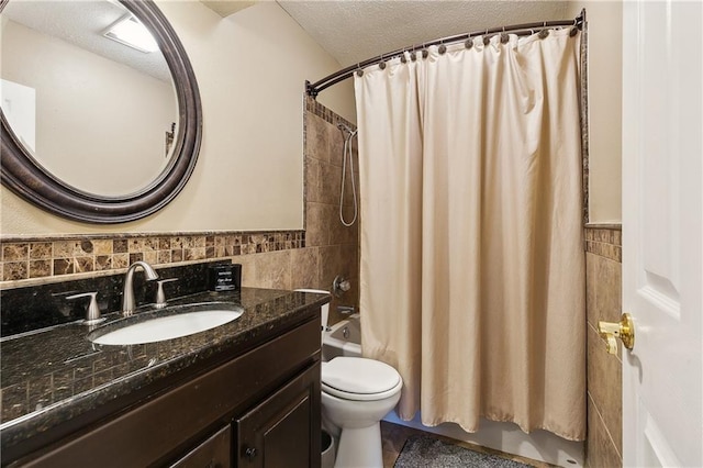 3121 Arbutus Ln, Marrero, LA 70072 - bathroom with tile walls, vanity, toilet, shower / bathtub combination with curtain, and a textured ceiling