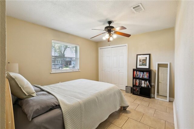3121 Arbutus Ln, Marrero, LA 70072 - bedroom with light tile patterned floors, a closet, and ceiling fan