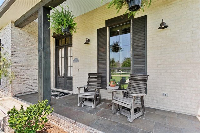 500 Tallow Tree Dr, Madisonville, LA 70447 - view of covered porch
