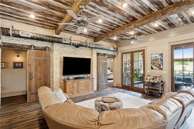 500 Tallow Tree Dr, Madisonville, LA 70447 - living room featuring a barn door, ceiling fan, baseboards, wooden ceiling with exposed beams, and recessed lighting