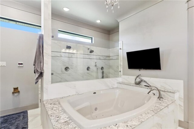 500 Tallow Tree Dr, Madisonville, LA 70447 - full bath with a jetted tub, a walk in shower, marble finish floors, recessed lighting, and baseboards