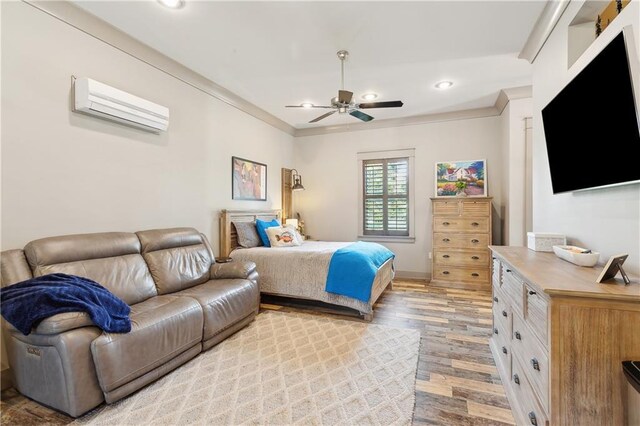 500 Tallow Tree Dr, Madisonville, LA 70447 - bedroom with a wall mounted AC, light wood-style floors, recessed lighting, crown molding, and ceiling fan