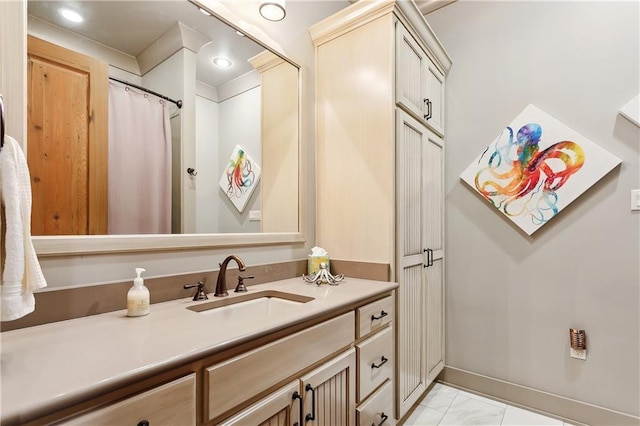 500 Tallow Tree Dr, Madisonville, LA 70447 - bathroom featuring vanity, marble finish floors, and baseboards