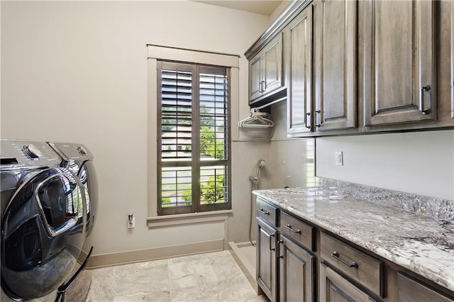 500 Tallow Tree Dr, Madisonville, LA 70447 - washroom featuring cabinet space, washing machine and dryer, baseboards, and plenty of natural light