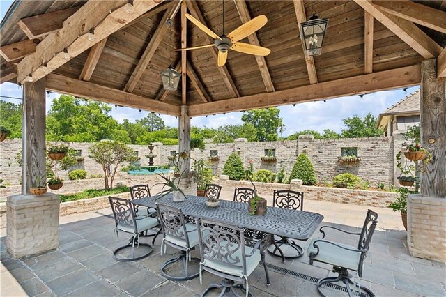 500 Tallow Tree Dr, Madisonville, LA 70447 - fenced backyard with a gazebo, outdoor dining area, a patio, and a ceiling fan