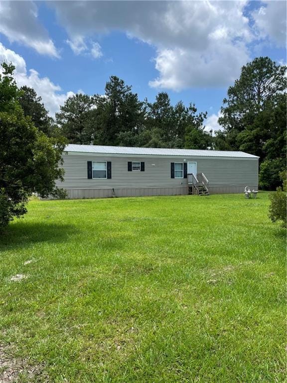 22056 Chappepeela Rd, Loranger, LA 70446 - rear view of house with a yard and entry steps