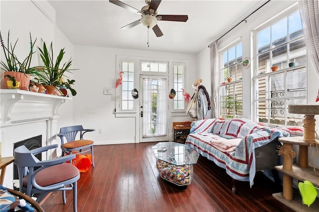 441214 Eden St, New Orleans, LA 70125 - living room featuring ceiling fan, hardwood / wood-style floors, baseboards, and a fireplace