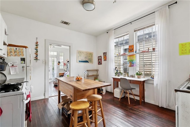 441214 Eden St, New Orleans, LA 70125 - dining area featuring a desk and dark wood finished floors
