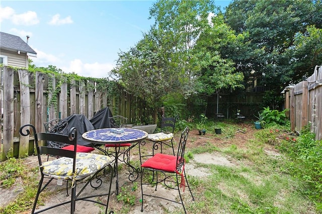 441214 Eden St, New Orleans, LA 70125 - fenced backyard featuring outdoor dining space and a patio area