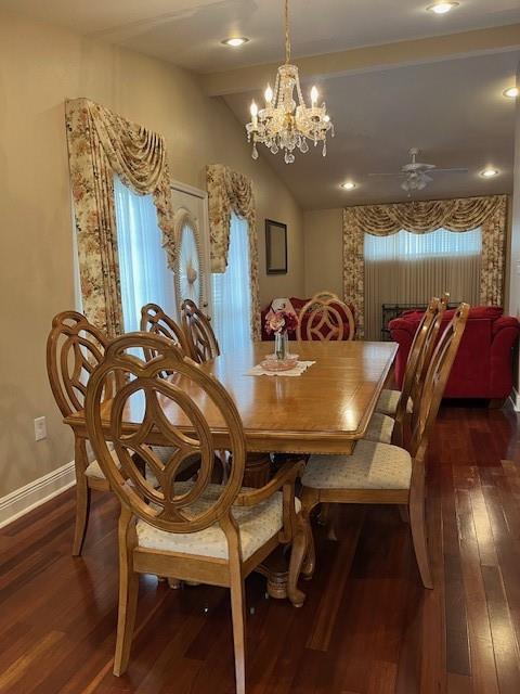 5917 Campus Blvd, New Orleans, LA 70126 - dining room with dark wood-type flooring, vaulted ceiling, a chandelier, baseboards, and a ceiling fan
