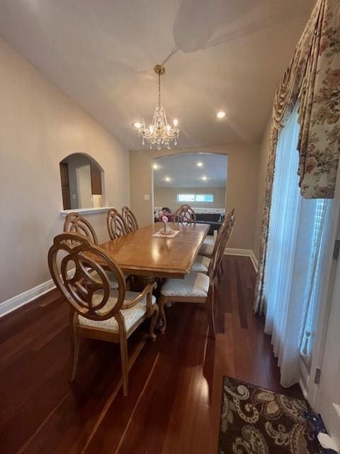 5917 Campus Blvd, New Orleans, LA 70126 - dining space featuring baseboards, dark wood-style flooring, and a chandelier