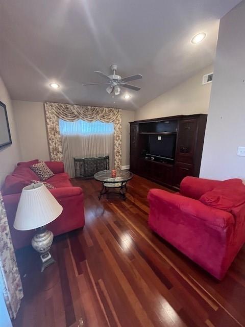 5917 Campus Blvd, New Orleans, LA 70126 - living area with ceiling fan, wood finished floors, lofted ceiling, a fireplace, and recessed lighting
