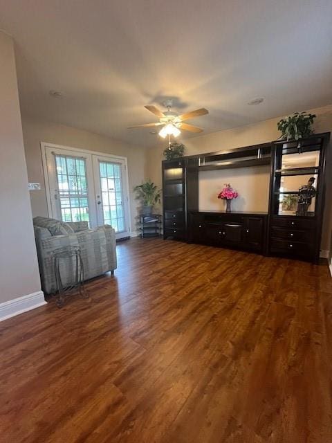 5917 Campus Blvd, New Orleans, LA 70126 - living area featuring dark wood-type flooring, baseboards, and a ceiling fan