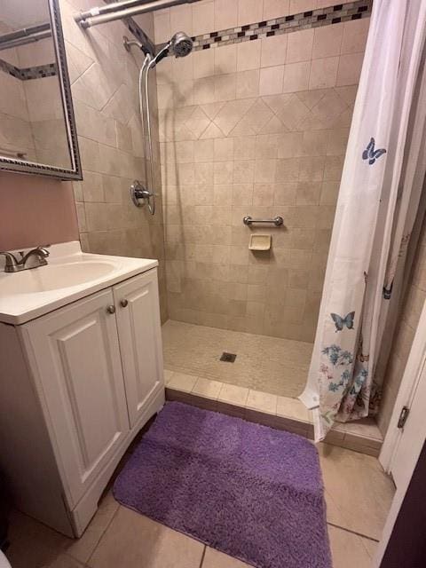 5917 Campus Blvd, New Orleans, LA 70126 - full bathroom featuring tiled shower, tile patterned flooring, and vanity