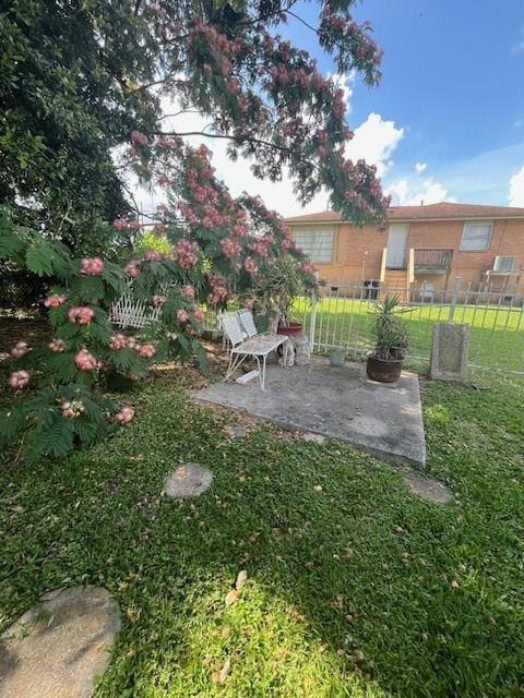 5917 Campus Blvd, New Orleans, LA 70126 - view of yard with a patio