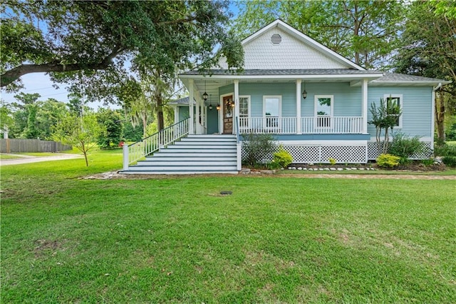 237 Villere Dr, Destrehan, LA 70047 - view of front of property featuring a porch, a front yard, and stairs