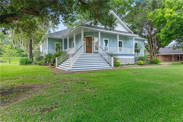 237 Villere Dr, Destrehan, LA 70047 - view of front of home with stairway, a porch, and a front yard