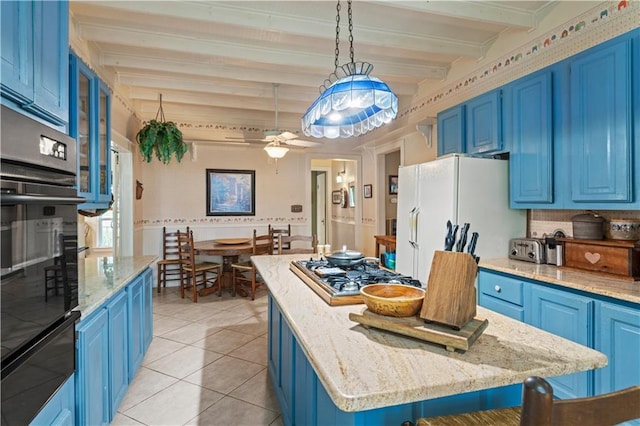 237 Villere Dr, Destrehan, LA 70047 - kitchen featuring blue cabinetry, stainless steel gas cooktop, and beamed ceiling
