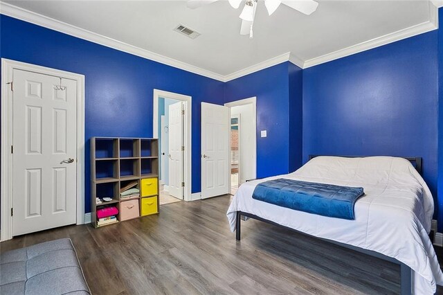 506 Doctor Gorman Dr, Belle Chasse, LA 70037 - bedroom with wood finished floors, ornamental molding, baseboards, a ceiling fan, and ensuite bath