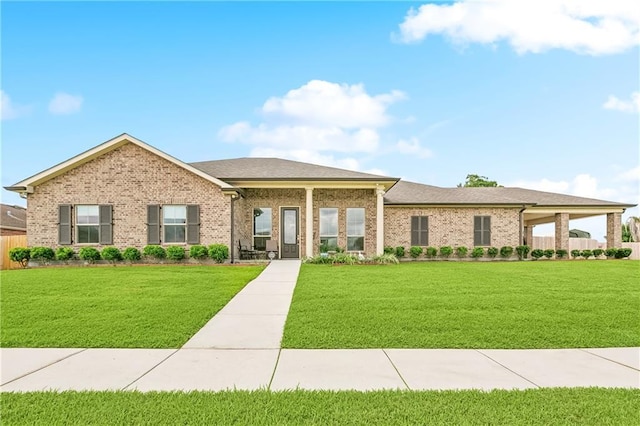 5001 Randolph St, Marrero, LA 70072 - view of front of home featuring a front lawn and brick siding
