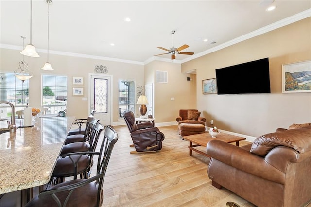 5001 Randolph St, Marrero, LA 70072 - living area with ceiling fan, ornamental molding, baseboards, recessed lighting, and light wood-type flooring