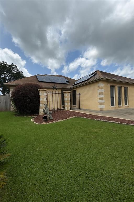 13801 Horizon Dr, New Orleans, LA 70129 - rear view of property featuring roof mounted solar panels