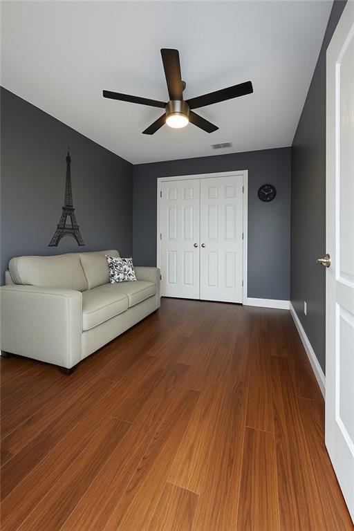 13801 Horizon Dr, New Orleans, LA 70129 - living area with ceiling fan, wood finished floors, and baseboards