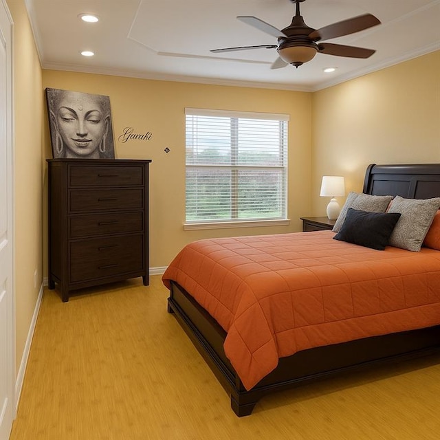 13801 Horizon Dr, New Orleans, LA 70129 - bedroom with light wood finished floors, crown molding, baseboards, recessed lighting, and ceiling fan