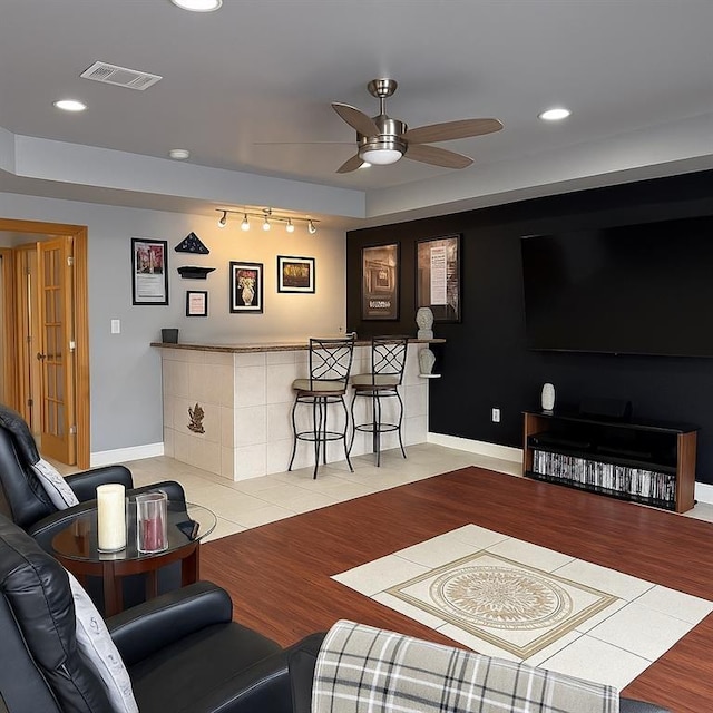 13801 Horizon Dr, New Orleans, LA 70129 - living room with wood finished floors, ceiling fan, bar, baseboards, and recessed lighting