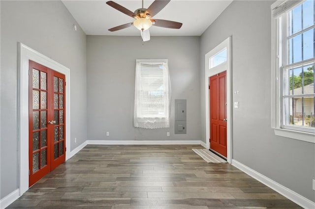 5530 Dauphine St, New Orleans, LA 70117 - foyer entrance with french doors, dark wood-type flooring, a ceiling fan, and baseboards