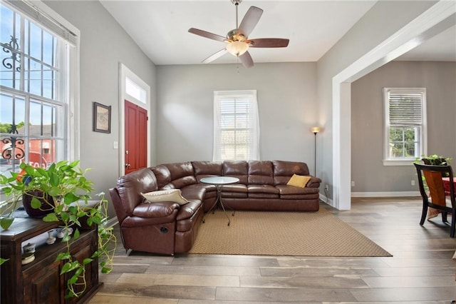 5530 Dauphine St, New Orleans, LA 70117 - living area featuring healthy amount of natural light, wood finished floors, and ceiling fan