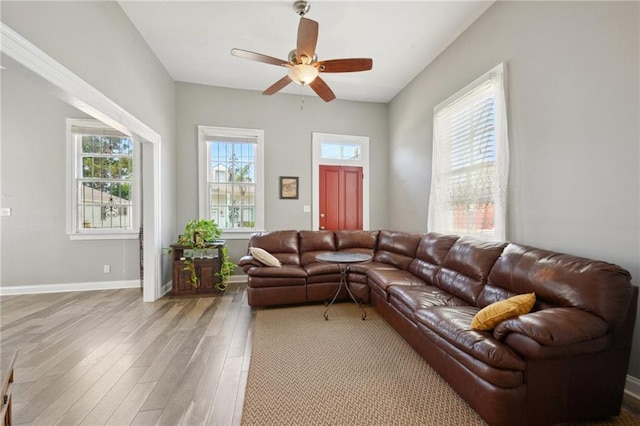 5530 Dauphine St, New Orleans, LA 70117 - living area with wood finished floors, a ceiling fan, and baseboards