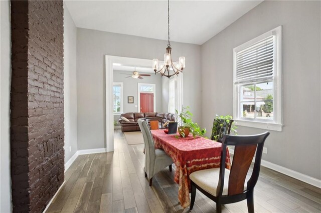 5530 Dauphine St, New Orleans, LA 70117 - dining room featuring a chandelier, hardwood / wood-style flooring, and plenty of natural light