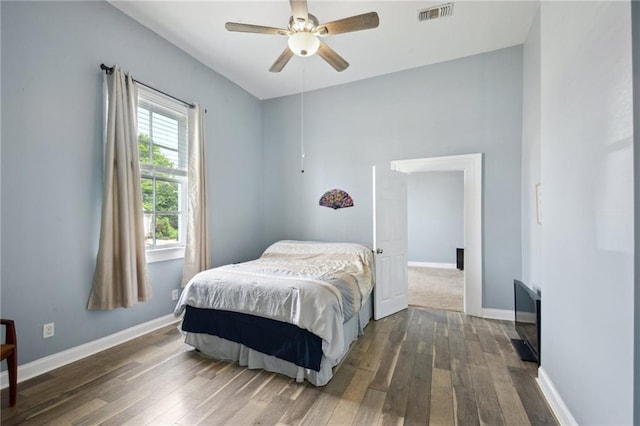 5530 Dauphine St, New Orleans, LA 70117 - bedroom featuring dark wood-style floors, baseboards, and a ceiling fan