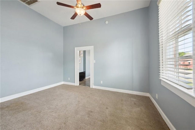 5530 Dauphine St, New Orleans, LA 70117 - carpeted empty room with a ceiling fan and baseboards