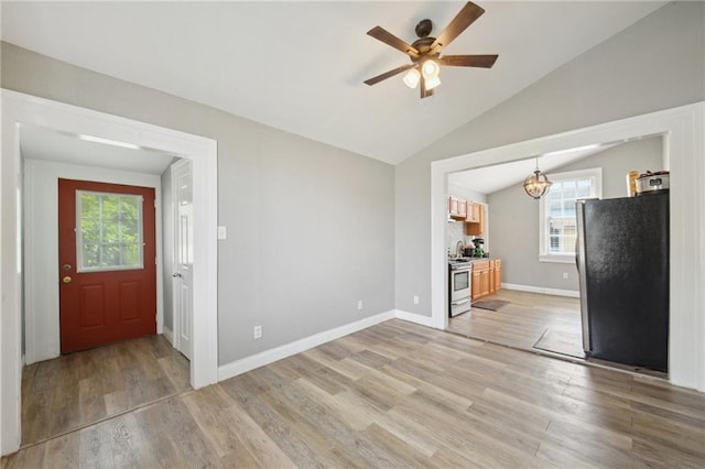 5530 Dauphine St, New Orleans, LA 70117 - unfurnished living room with healthy amount of natural light, light wood finished floors, a chandelier, lofted ceiling, and ceiling fan