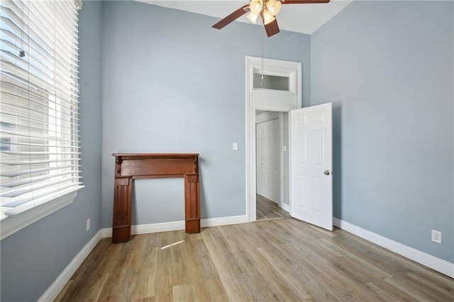 5530 Dauphine St, New Orleans, LA 70117 - empty room featuring a ceiling fan, wood finished floors, and baseboards
