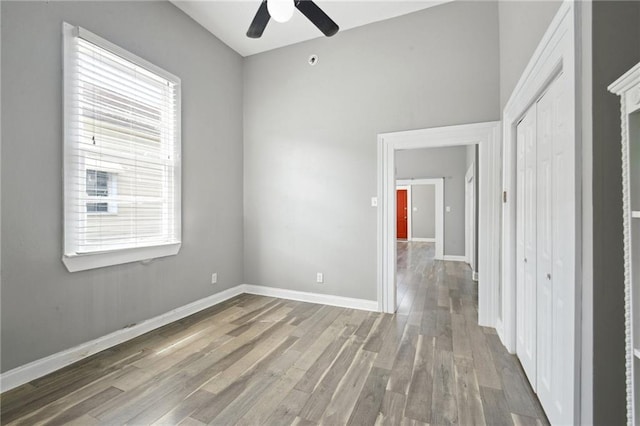 5530 Dauphine St, New Orleans, LA 70117 - spare room featuring ceiling fan, wood finished floors, and baseboards