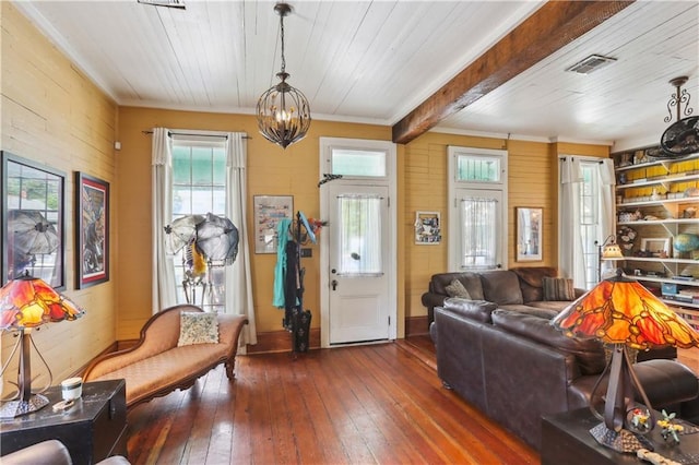 518 Pacific Ave, New Orleans, LA 70114 - living room with a chandelier, ornamental molding, wood-type flooring, wooden ceiling with exposed beams, and wooden walls