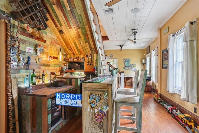 518 Pacific Ave, New Orleans, LA 70114 - dining space with wooden walls and hardwood / wood-style flooring