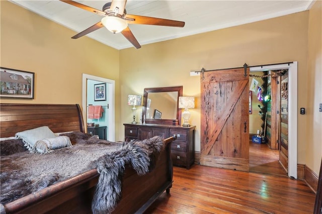 518 Pacific Ave, New Orleans, LA 70114 - bedroom with hardwood / wood-style flooring, a barn door, ceiling fan, and ornamental molding
