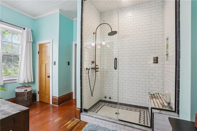 518 Pacific Ave, New Orleans, LA 70114 - bathroom featuring a shower stall, hardwood / wood-style flooring, crown molding, vanity, and baseboards
