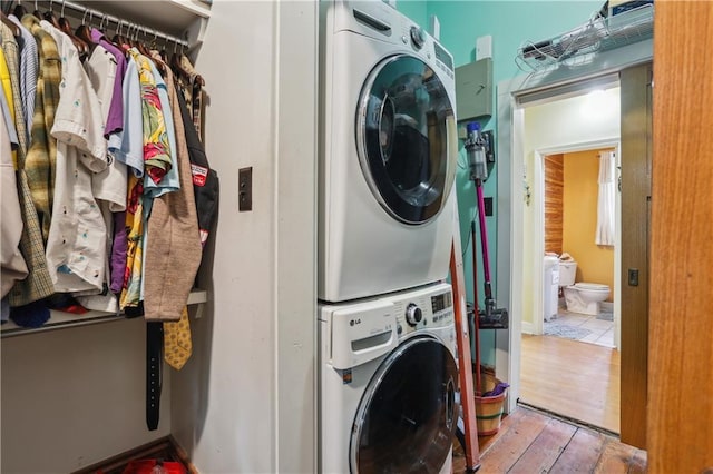 518 Pacific Ave, New Orleans, LA 70114 - laundry room with estacked washer and dryer and hardwood / wood-style flooring