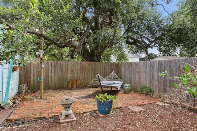 518 Pacific Ave, New Orleans, LA 70114 - fenced backyard with a patio area