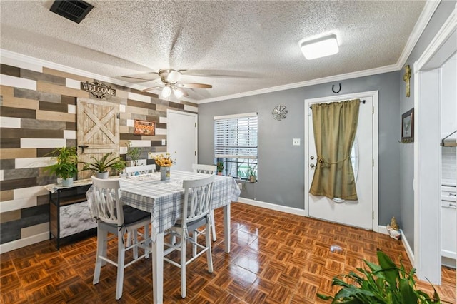 5304 Cross Creek Dr, Marrero, LA 70072 - dining room with baseboards, a ceiling fan, a textured ceiling, and ornamental molding