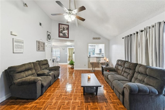 5304 Cross Creek Dr, Marrero, LA 70072 - living area featuring baseboards, a ceiling fan, and high vaulted ceiling