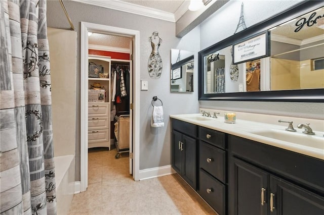 5304 Cross Creek Dr, Marrero, LA 70072 - bathroom featuring ornamental molding, double vanity, tile patterned floors, baseboards, and a walk in closet