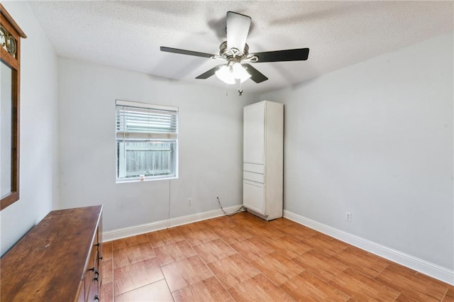 5304 Cross Creek Dr, Marrero, LA 70072 - unfurnished bedroom with a textured ceiling, light wood-style flooring, baseboards, and ceiling fan