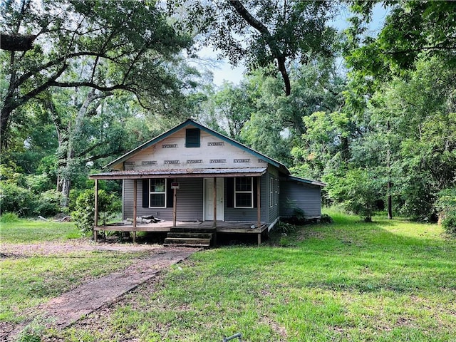 99 White St, Hammond, LA 70403 - view of front of house featuring a front yard and covered porch